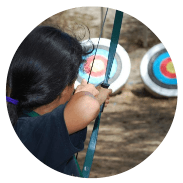 Girl doing archery as a sample camp activity at the Conejo Valley Camp Fair