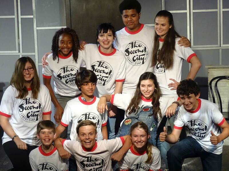 Group of 11 aspiring actors and actresses wearing Second City Comedy Camp t-shirts posing for a group photo at camp.