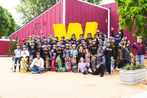 Group of campers and staff with their skateboards at Woodward West summer overnight camp.