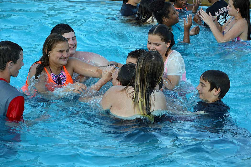 Campers playing in a swimming pool at summer camp in Los Angeles.