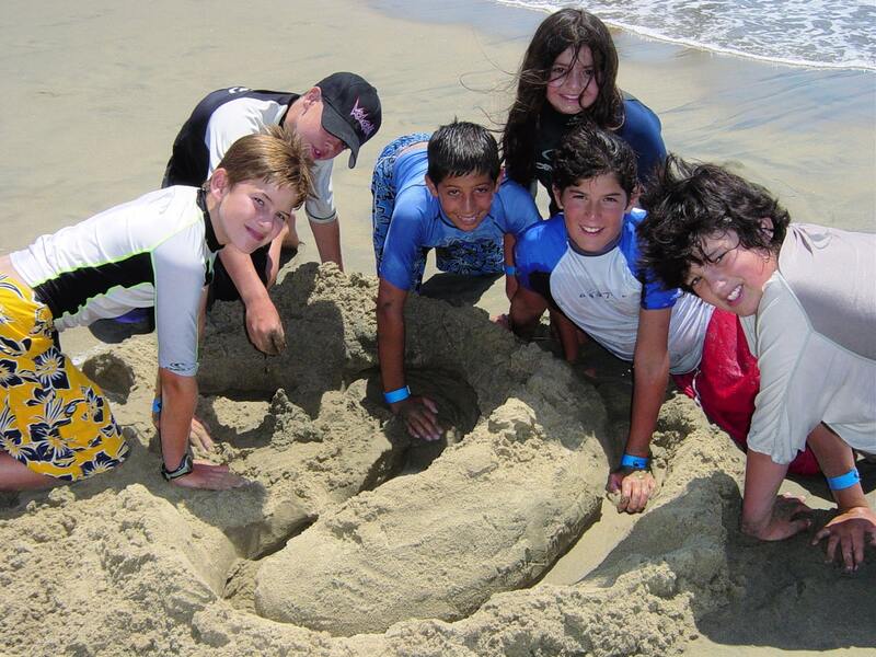 Campers playing together on Zuma Beach at Aloha Beach Camp summer day camp,