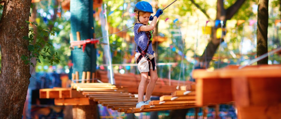 Boy on a ropes course at summer camp in Pasadena
