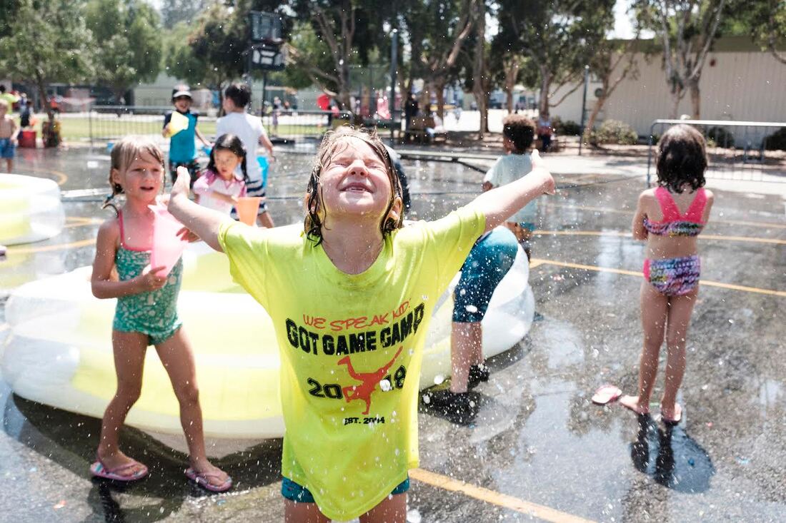 Campers enjoying water play at Got Game Camp in Los Angeles, CA,