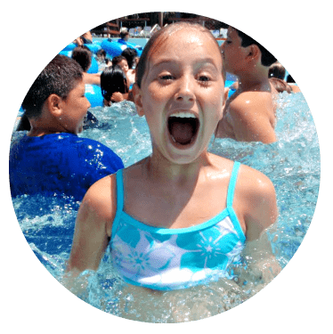 Girl from Mar Vista in a swimming pool at a summer camp she and her family found by attending the L.A. Camp Fair 