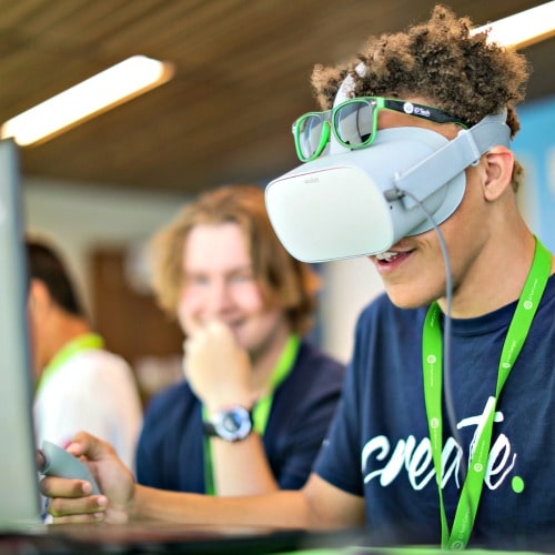 Teenage boy doing a virtual reality activity at iD Tech Camp.