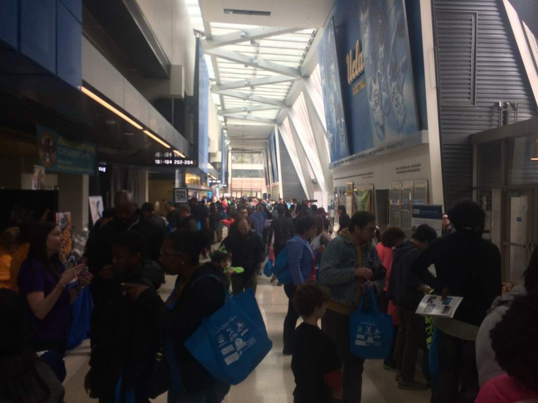 Hallway at UCLA's Pauley Pavillion jam packed with families and summer camp vendors at the L.A. Camp Fair on Sunday, March 11, 2018 at UCLA