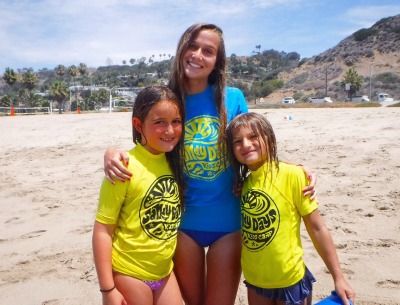 Two  young campers on the beach with their camp counselor at Sandy Kids Day Camp