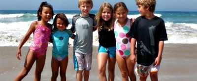 6 kids standing together on the beach at Silverlake Summer Camps