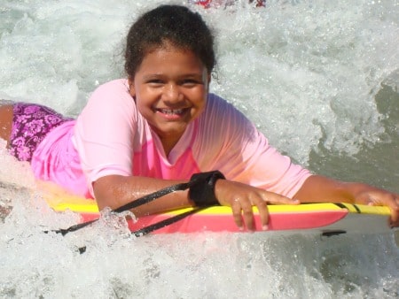 Female camper from Studio City boogie boarding at Aloha Beach Camp Summer Camp
