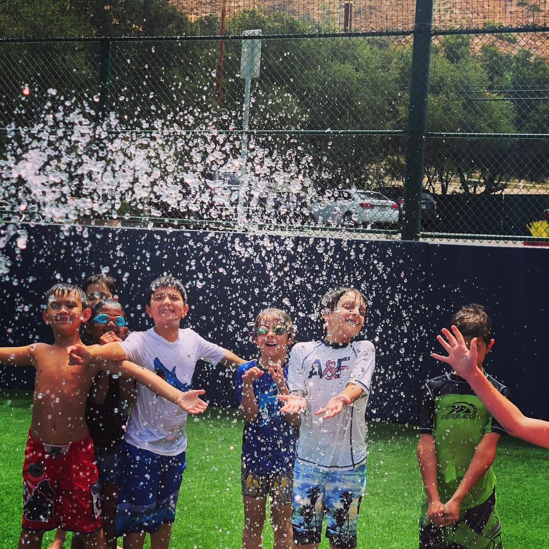 Campers splashing in water at Summer at Viewpoint summer programs